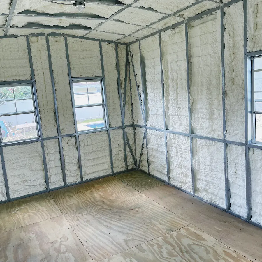 Closed-cell spray foam insulation applied to wall cavities in a residential project in Cadillac